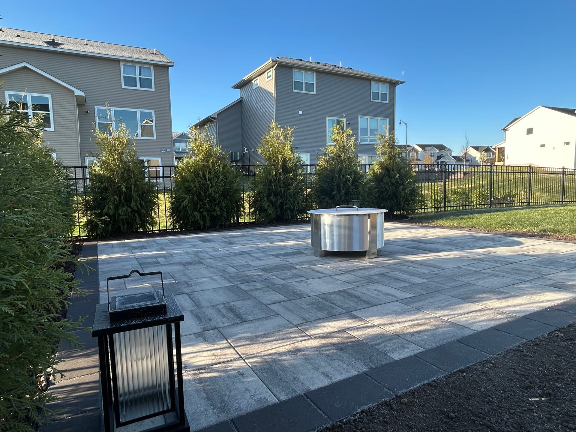 Paver Patio and Privacy Trees Built for Real Backyard Living image