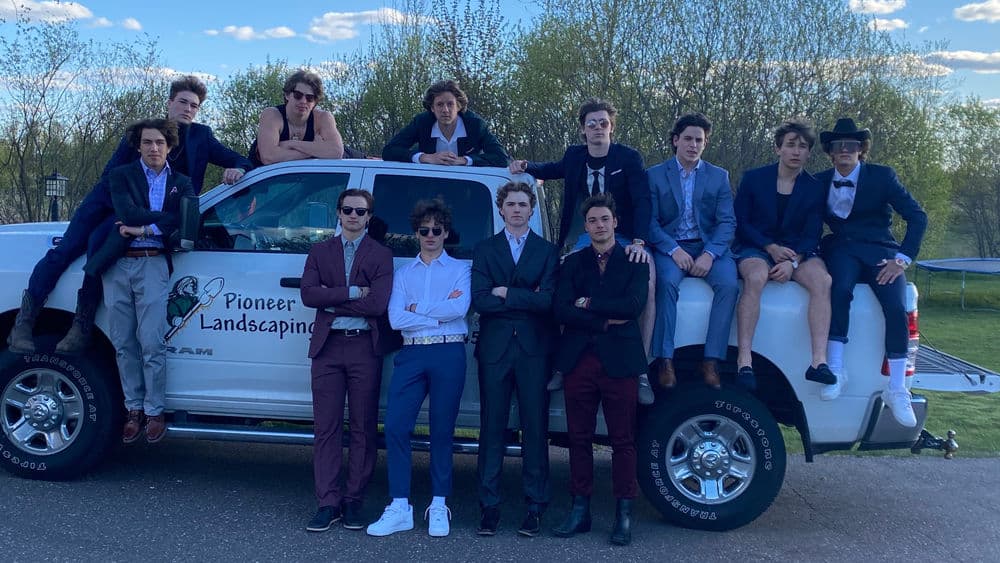 Beautifully designed outdoor living space with a custom patio and fire pit by Pioneer Landscaping, Lake Elmo, MN.