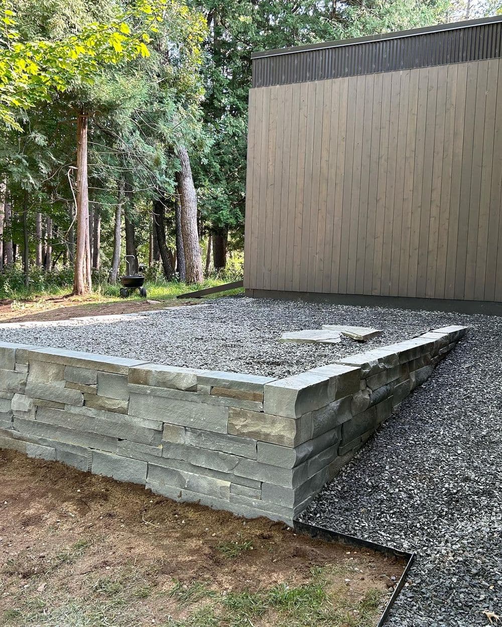 Expert installation of a retaining wall using high-quality materials by Pioneer Landscaping.